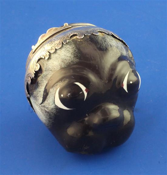 A 19th century French? silver mounted painted enamel bonbonniere modelled as the head of a Pug, diameter 2.25in.